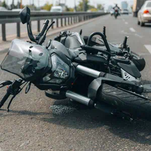 Motorcycle lying on the road after a motorcycle accident